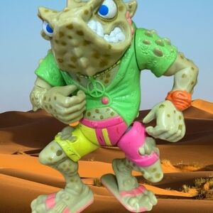 Reptile Action Figure with Green and Pink Outfit